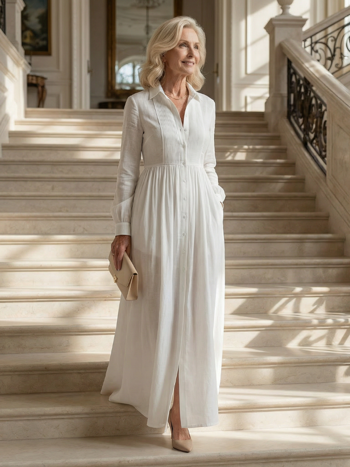 Effortless women's long sleeve white maxi dress. Soft, flowy, and comfortable with a classic button-front design.