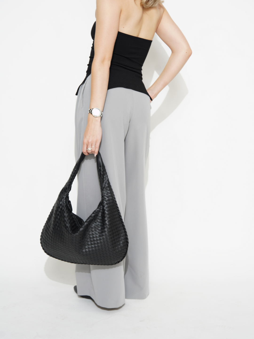 Modern vegan leather shoulder bag. Chic women's crossbody accessory for daily use.