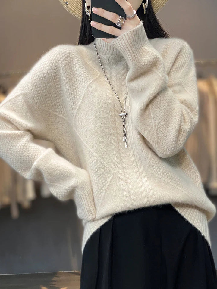 White women's cashmere roll neck sweater, featuring a cozy cable knit for winter elegance.