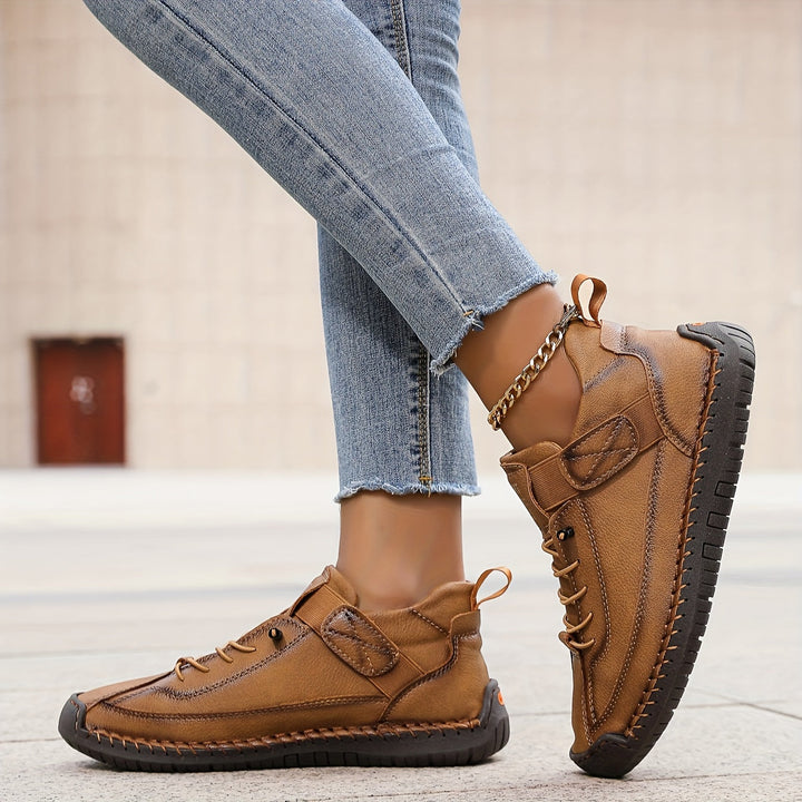Woman walking in orthopaedic comfort trainers, showcasing cushioned sole & supportive design for pain relief.