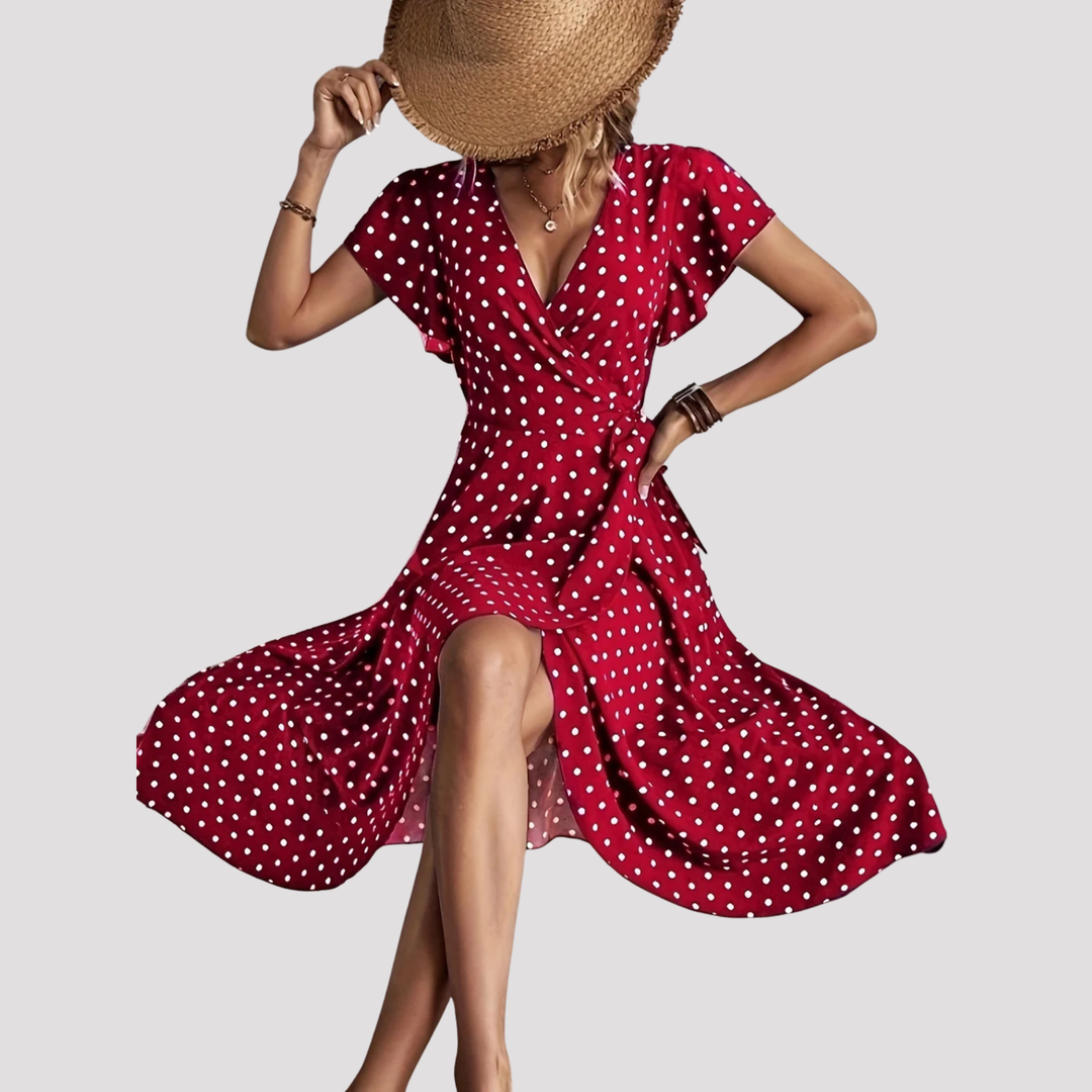 Women's chic polka dot wrap midi dress, an elegant and flattering casual summer dress with V-neck and flutter sleeves.