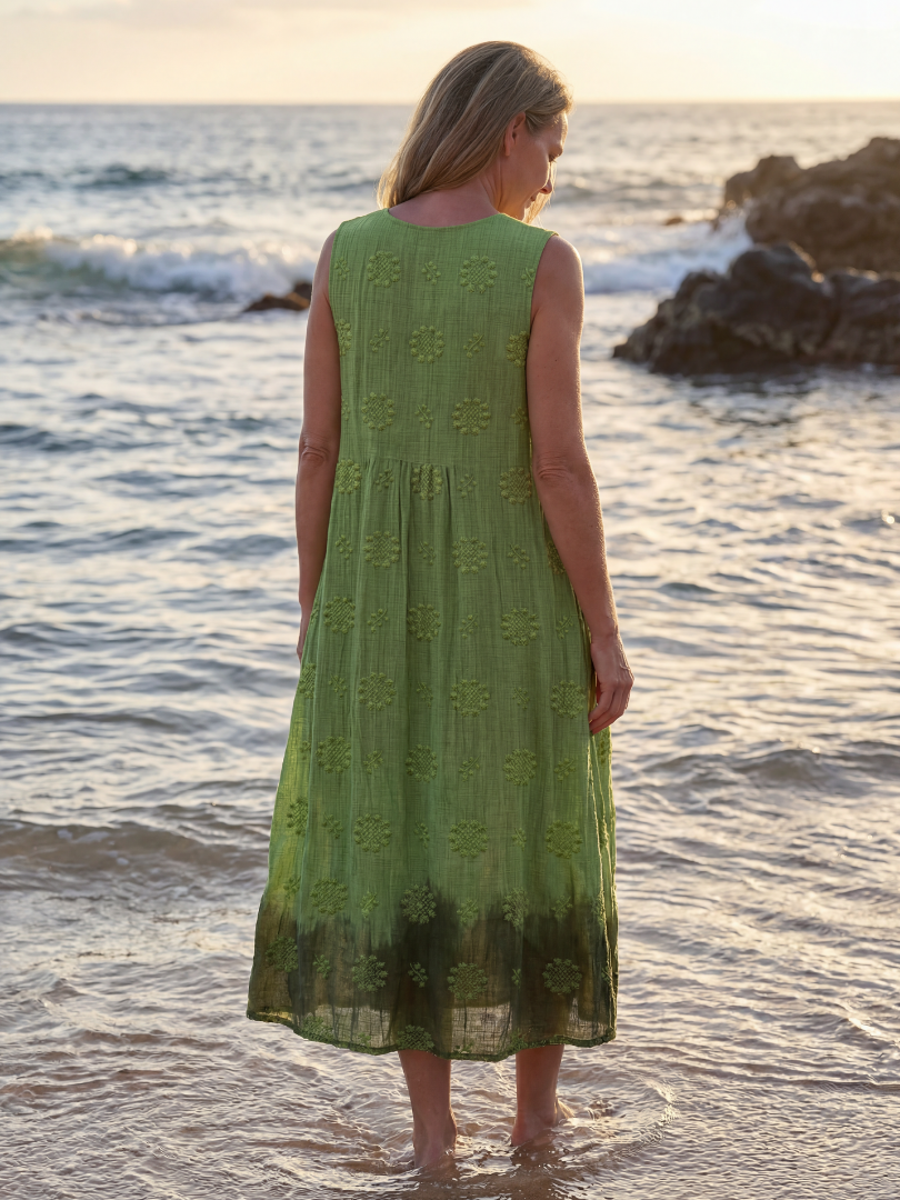 Women's green textured sleeveless midi dress. Comfortable relaxed fit, perfect pull-on style for summer casual wear.