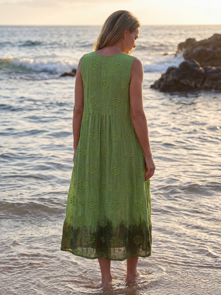 Women's green textured sleeveless midi dress. Comfortable relaxed fit, perfect pull-on style for summer casual wear.