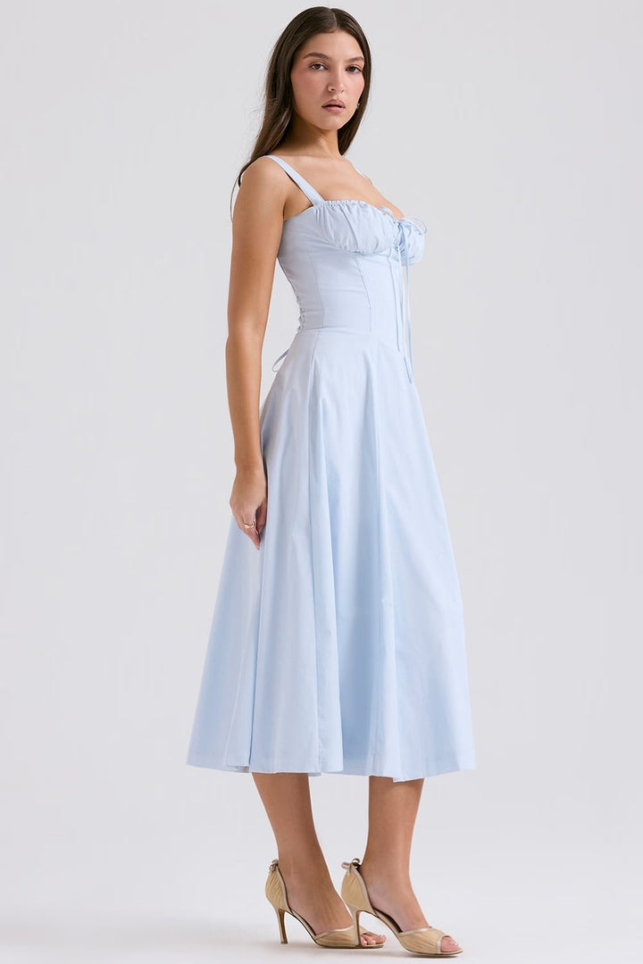 Close-up of the intricate lace-up detail on an elegant women's corset midi dress.