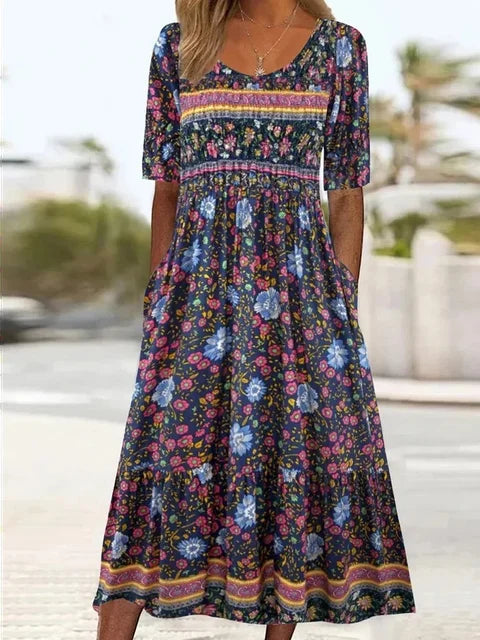Woman wearing a chic effortless boho midi dress with short sleeves, perfect for a stylish summer or vacation look.