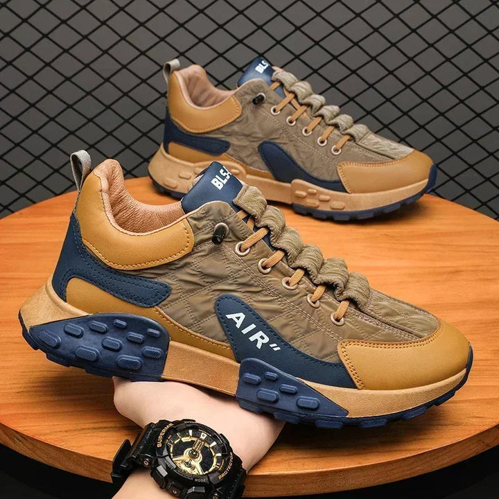 Modern men's athletic style trainers, black chunky platform design. Ideal urban footwear for a sleek casual look.