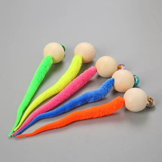 Close-up of an interactive cat toy with wagging tail & bell, ideal for stimulating pet play & enrichment.