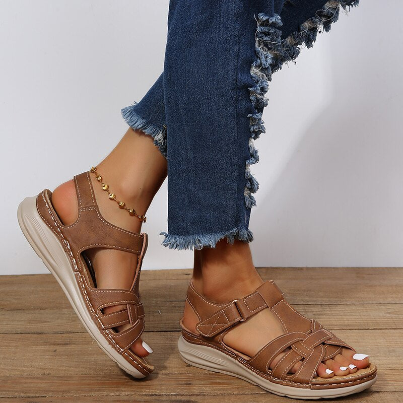 Brown supportive walking sandals for women, designed with arch support and comfort for extended everyday wear & travel.