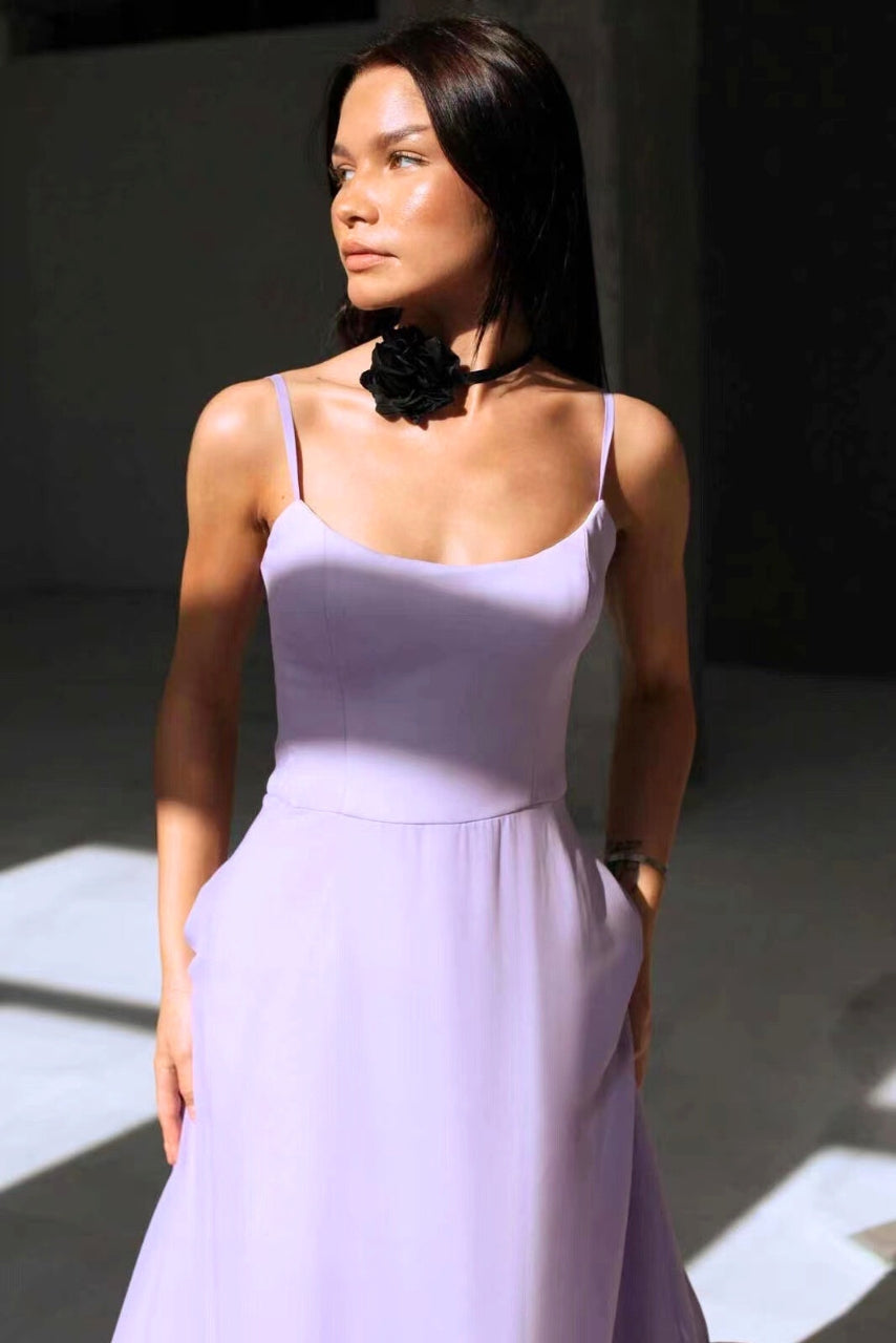 Stylish women's elegant flowing midi dress in a vibrant color, ideal formal wear for summer weddings & parties.