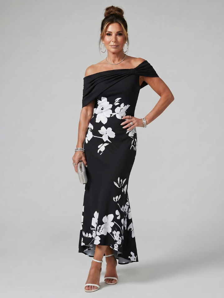 Classic black off-shoulder midi dress with a flattering draped neckline, embodying refined women's elegant style.