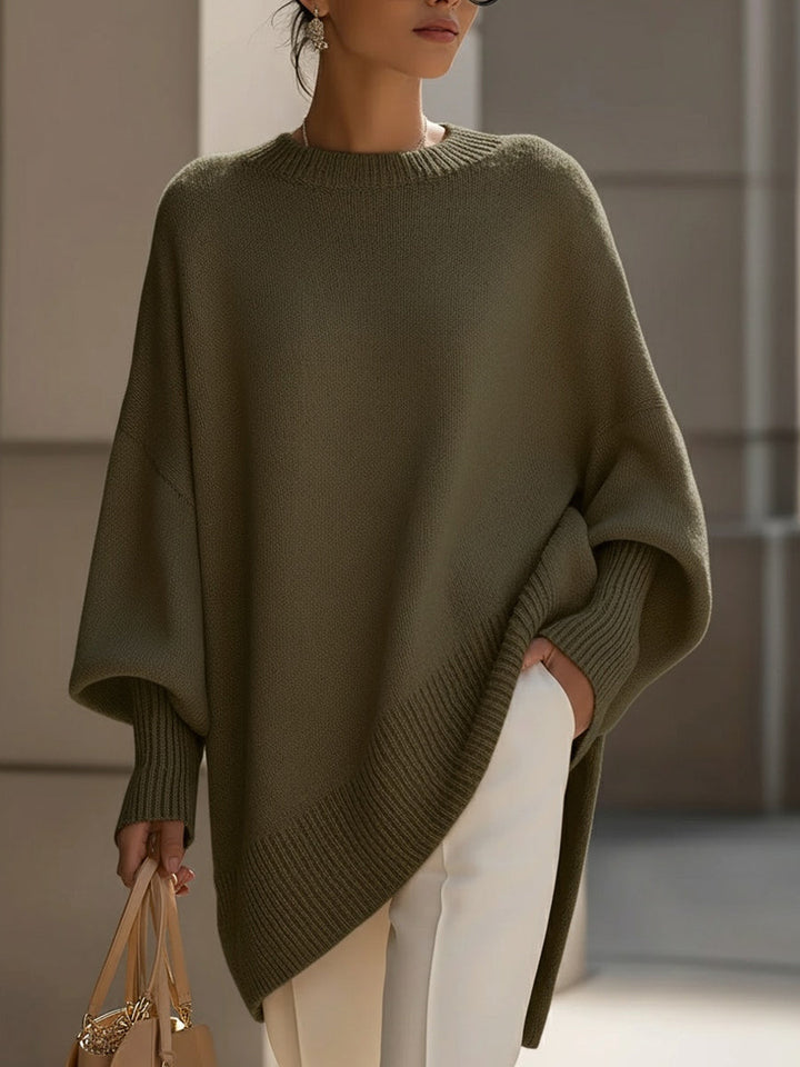 Fashionable women's oversized long sleeve sweater. Chic & comfortable, perfect for casual layering & winter style.