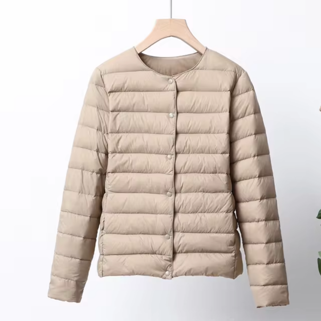 Sleek women's ultrathin puffer jacket, a lightweight and warm insulated outerwear piece for modern style.