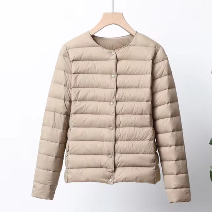 Sleek women's ultrathin puffer jacket, a lightweight and warm insulated outerwear piece for modern style.
