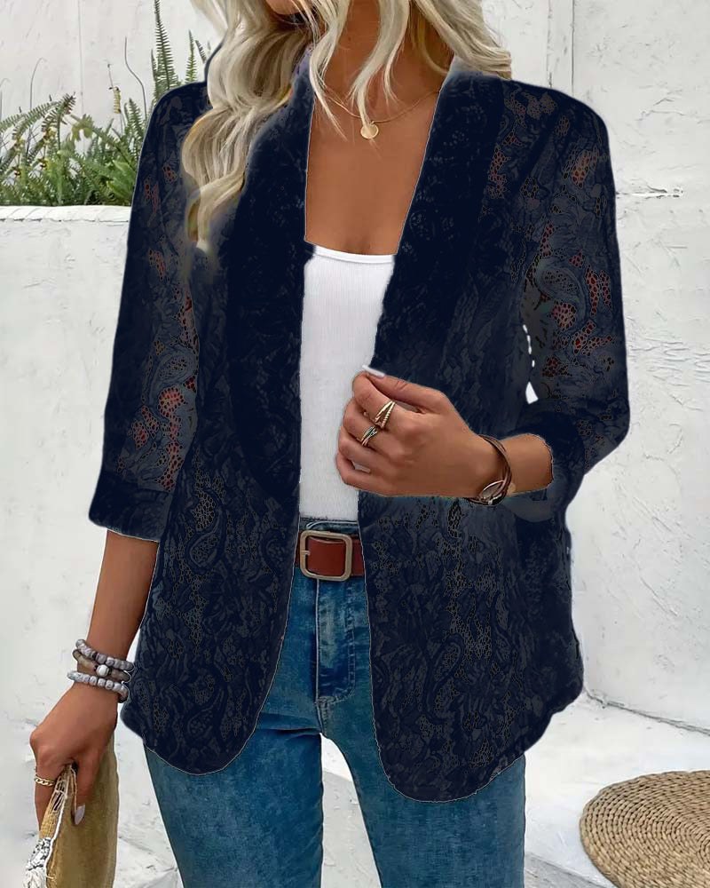 Elegant women's coat with a distinctive floral lace lapel collar, a fashionable long sleeve jacket.