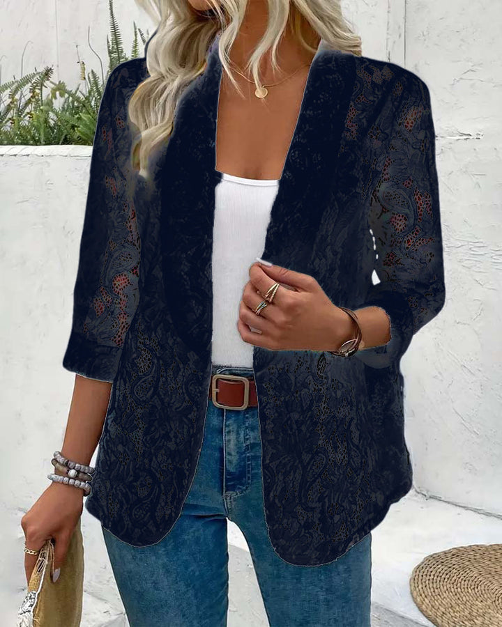 Elegant women's coat with a distinctive floral lace lapel collar, a fashionable long sleeve jacket.