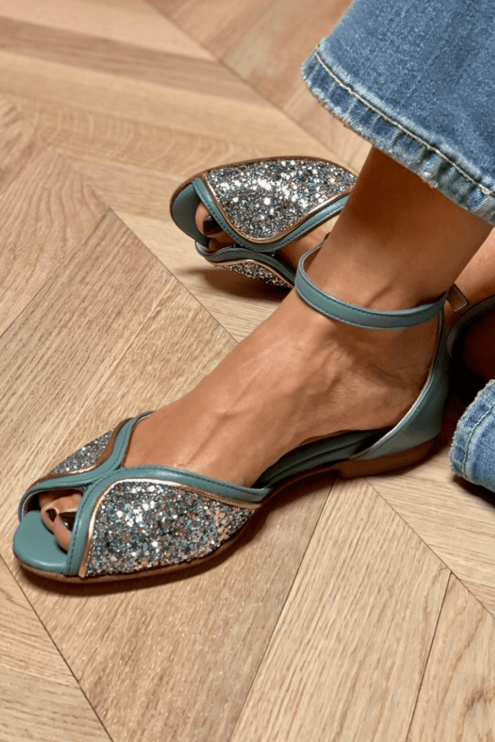Elegant women's luminous green flat sandals with sparkle & comfortable ankle strap, perfect for summer dressy occasions.