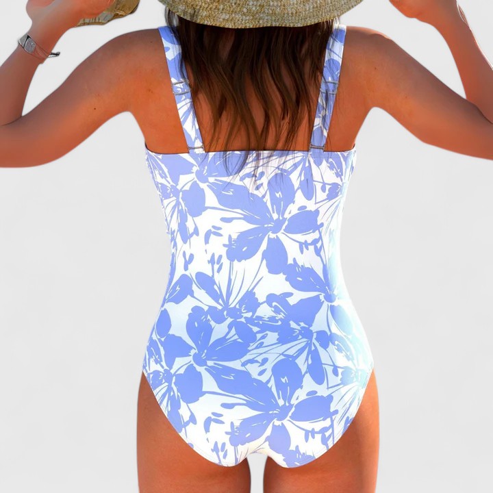 Vibrant modern print one-piece swimsuit for women. Versatile beachwear & pool party style for tropical getaways.