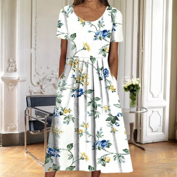 Chic women's floral midi dress for summer, featuring a comfortable short sleeve and classic round neck design.
