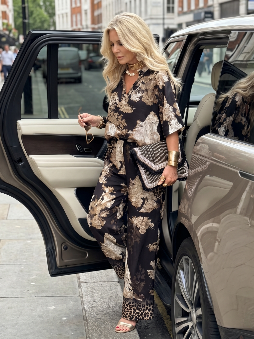 Stylish women's printed wrap top and wide leg trousers set. Comfortable, chic, and versatile for any summer occasion.