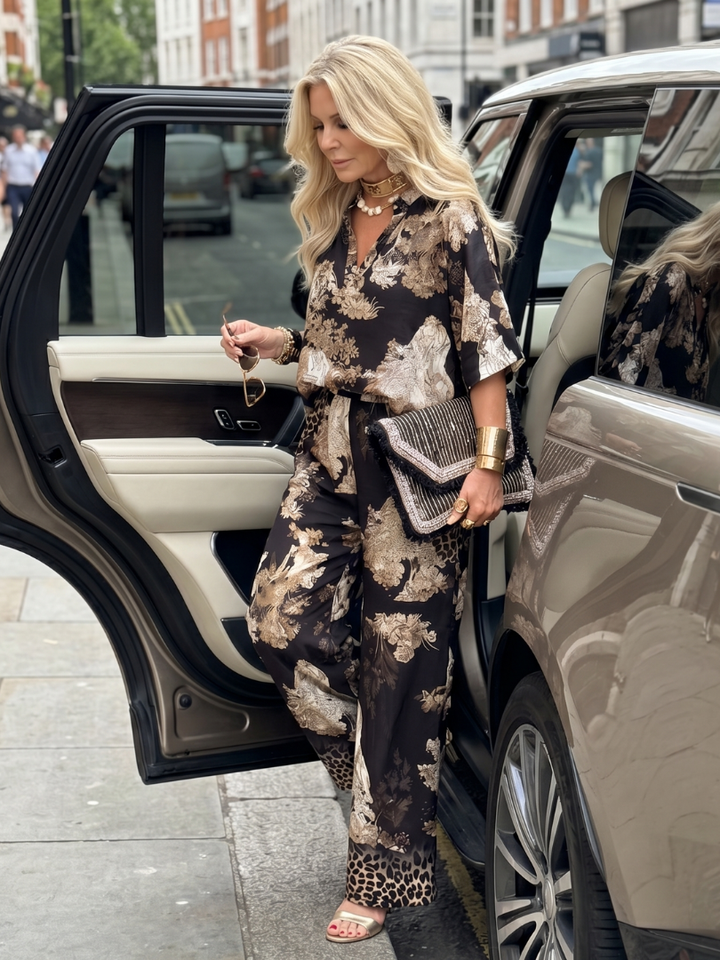 Stylish women's printed wrap top and wide leg trousers set. Comfortable, chic, and versatile for any summer occasion.