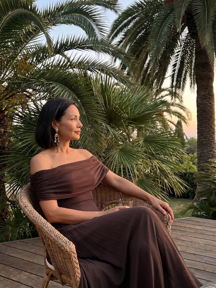 Stylish green off-shoulder cocktail dress, featuring an elegant draped design and midi length.