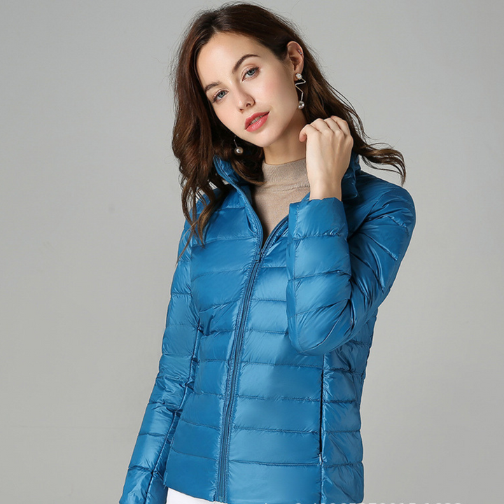 Modern women's ultralight waterproof jacket. Stylish & versatile for all-weather outdoor activities & everyday casual wear.