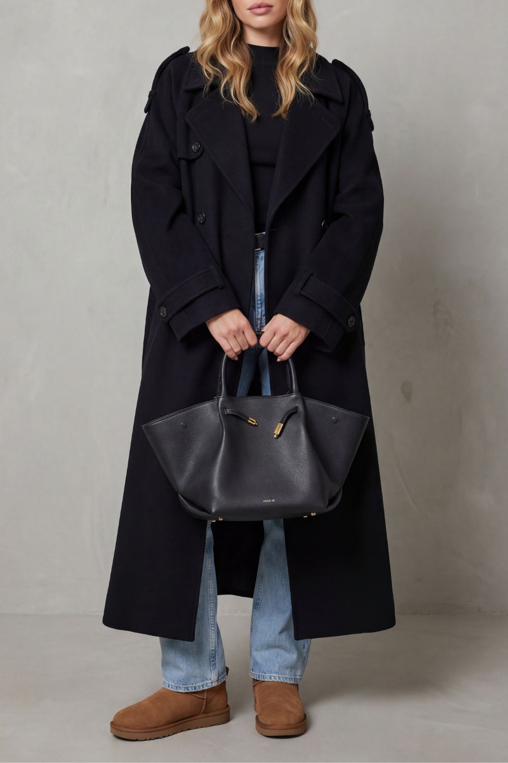 Oversized black trench coat for women. A chic, long fashion jacket perfect for stylish autumn & winter outerwear.