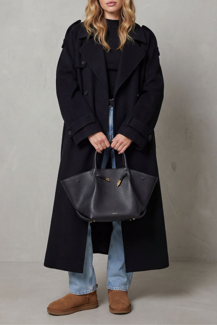 Oversized black trench coat for women. A chic, long fashion jacket perfect for stylish autumn & winter outerwear.