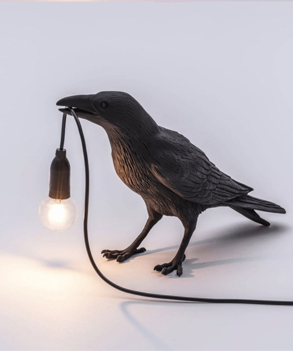 Artistic crow table lamp, unique design for modern home decor. A distinctive bird lamp.