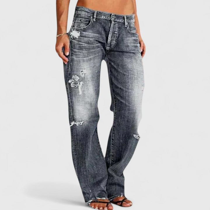 Blue low-rise wide-leg jeans for women, combining elegant style with a relaxed, comfortable fit for versatile fashion.