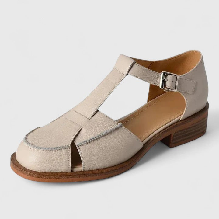 Elegant women's closed-toe T-strap sandals with a comfortable block heel in versatile beige for summer.