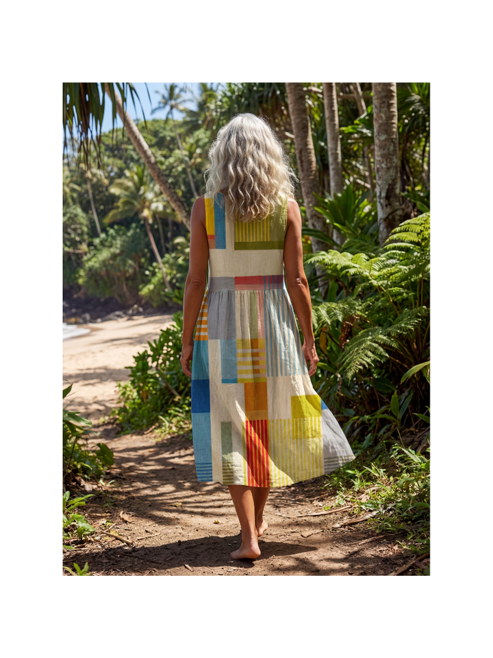 Relaxed fit women's midi dress featuring painted block print. Multi-color, sleeveless, perfect for comfortable daily wear.