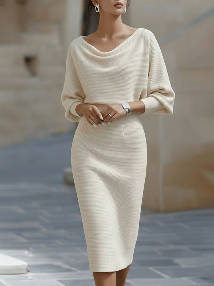 Elegant women's occasion midi dress, round neck and batwing sleeves, versatile for day or evening.