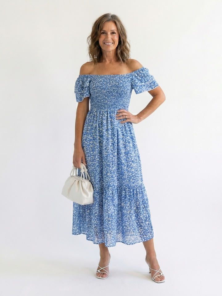 Vibrant floral print off shoulder midi dress with smocked top. A fashionable women's summer and spring casual dress.