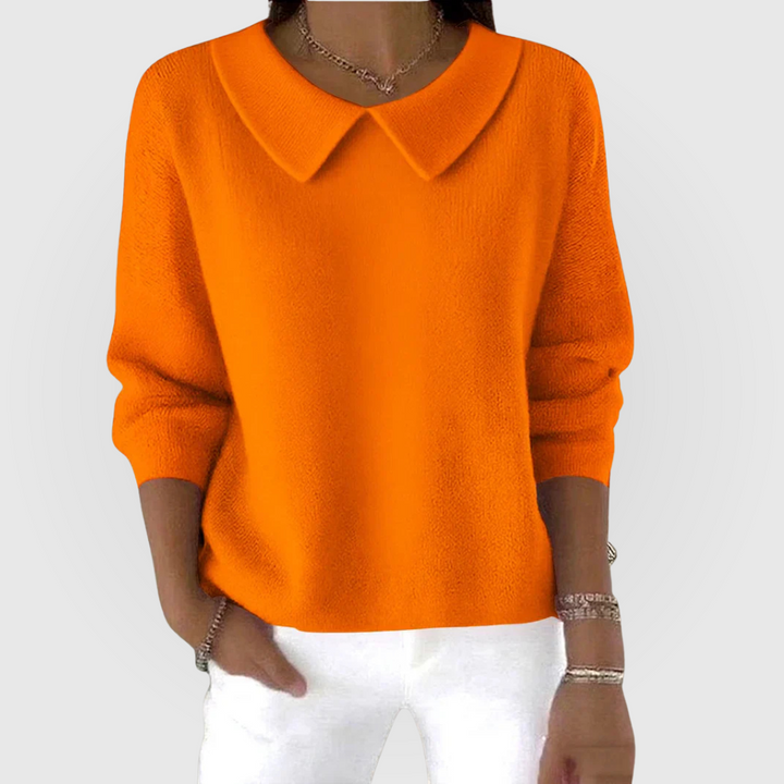 Soft pink women's classic jumper, relaxed long sleeve knit, ideal for elegant everyday wear.