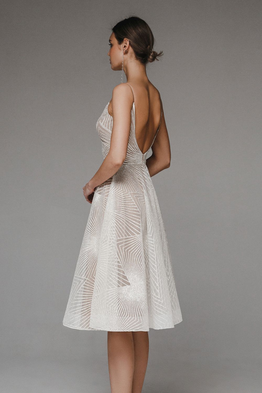 Shimmering women's elegant V-neck A-line dress with straps, a glamorous option for any special event.
