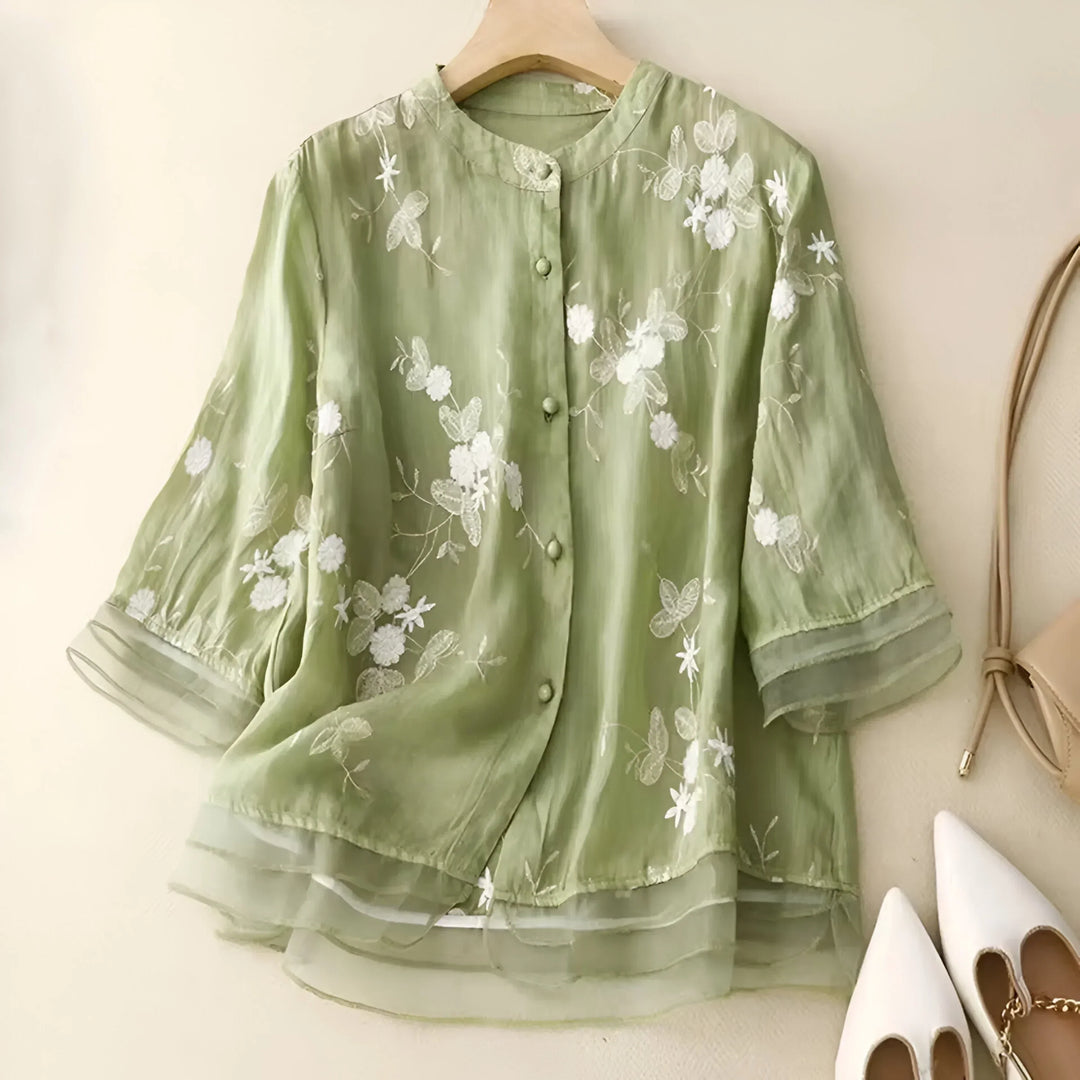 Versatile women's top: elegant embroidery, relaxed fit, and flattering tummy skimming silhouette.
