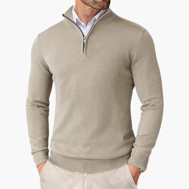 Close-up of a men's quarter zip pullover. Shows comfortable fabric, refined details & casual style.