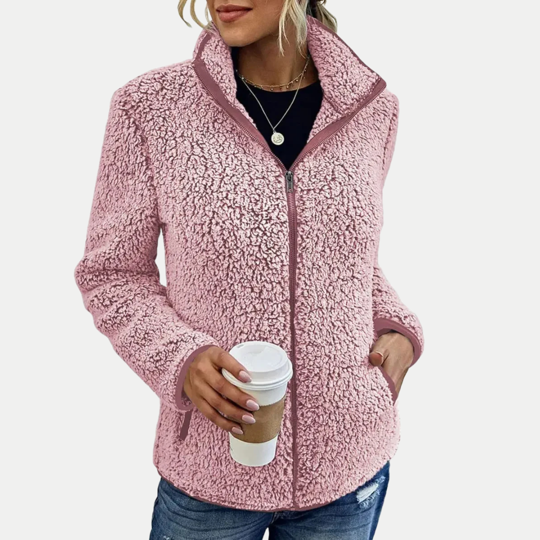 Women's long-sleeve textured fleece zip-up jacket with a high stand-up collar. Modern design for stylish women's apparel.
