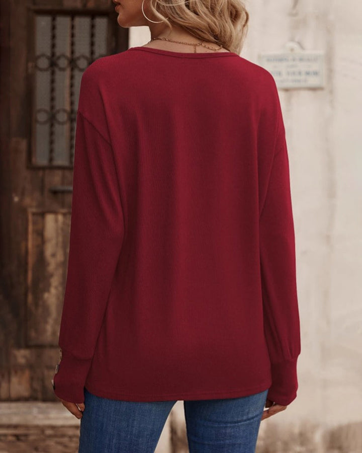 Comfortable women's casual long sleeve V-neck top, a solid color essential with fashionable buttons.
