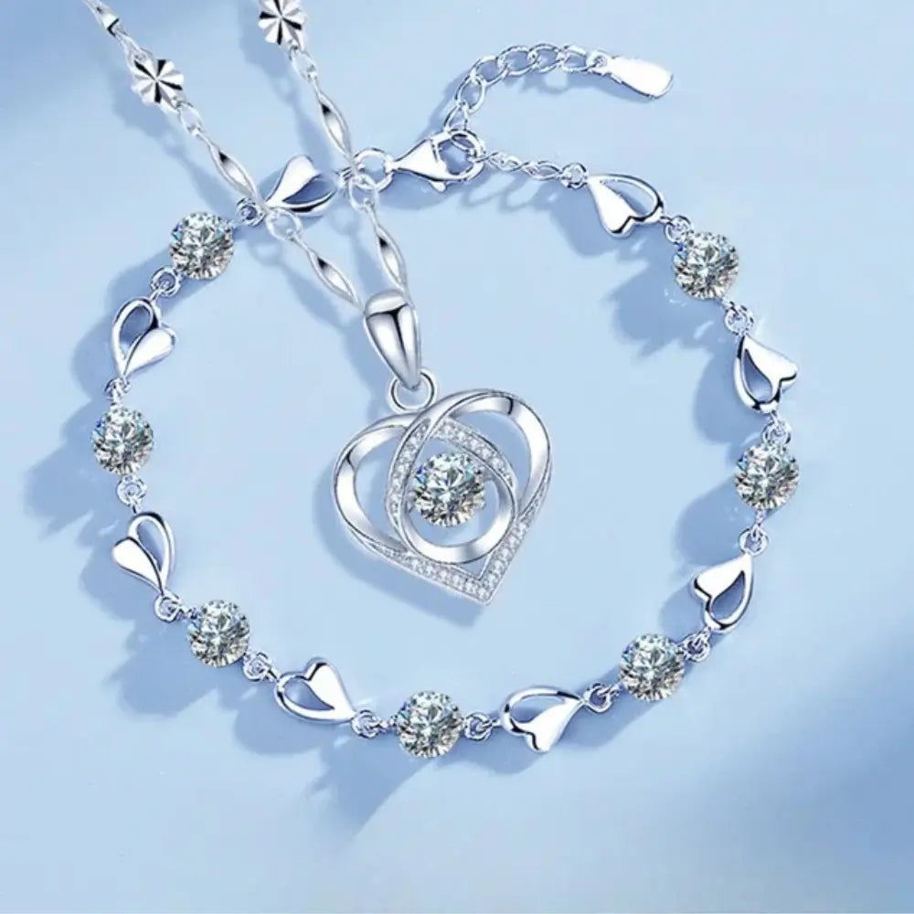 Beautiful sterling silver heart necklace and bracelet gift set for women, elegant and timeless jewelry.