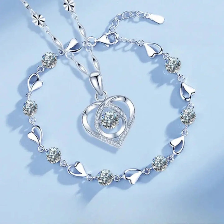Beautiful sterling silver heart necklace and bracelet gift set for women, elegant and timeless jewelry.