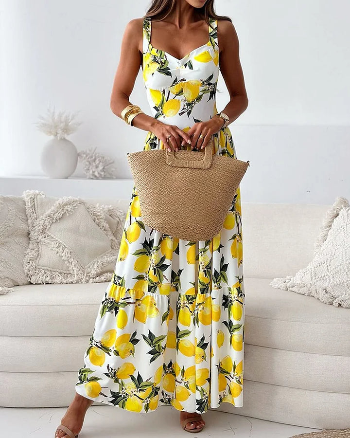 Women's vibrant lemon print midi strap dress, a cheerful and casual choice for spring and summer vacation wear.