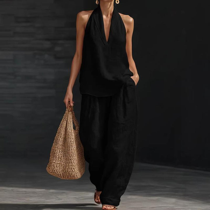 Casual women's two-piece linen blend set. Features a comfy batwing top and stylish wide-leg pants for summer.