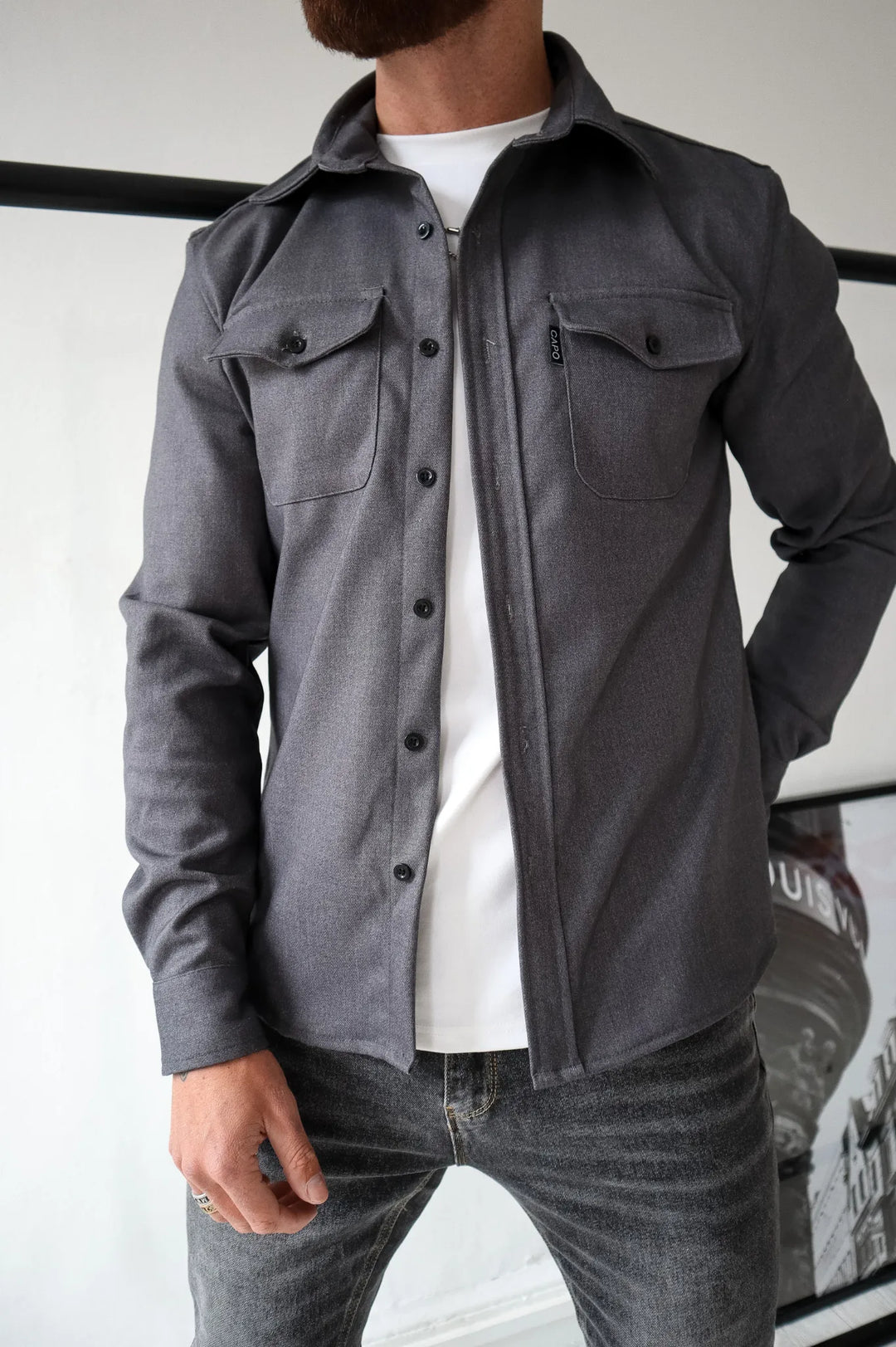 Stylish women's button-down shirt jacket. Water-resistant, long-sleeve outerwear for a chic, modern, casual look.