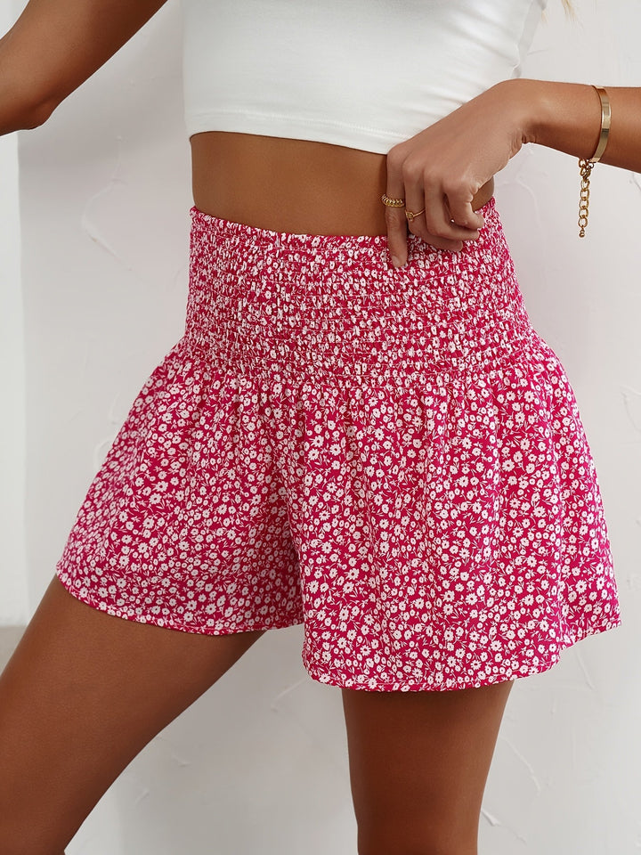 Women's vacation-ready shorts: lightweight, floral print, and comfy elastic waist.