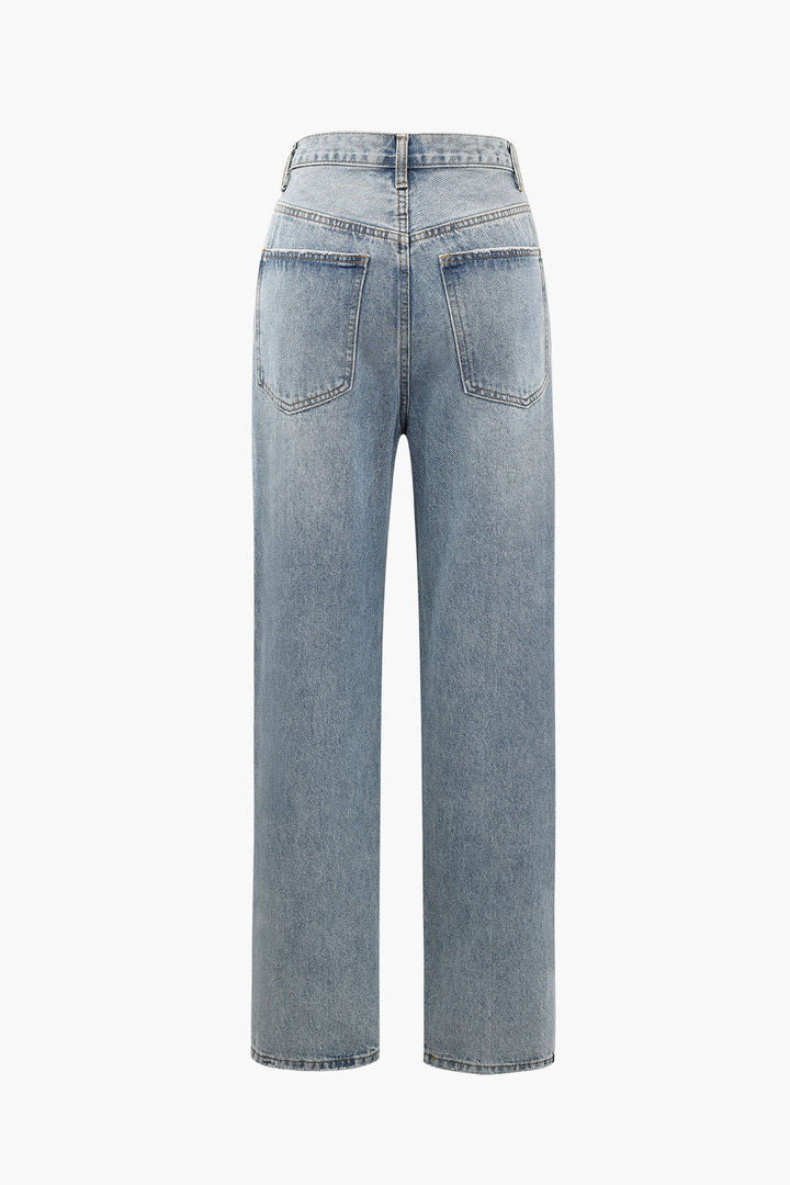 Stylish women's high-waisted straight-leg jeans with an asymmetric design. Modern, versatile light wash.