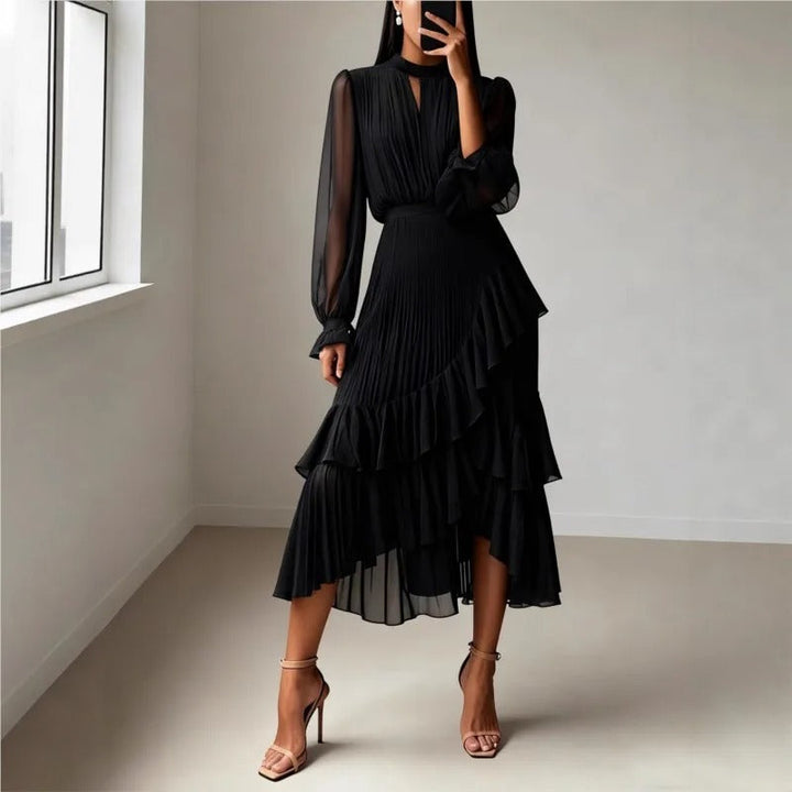 Stylish women's summer midi dress, featuring delicate pleats and a flowy, elegant silhouette.