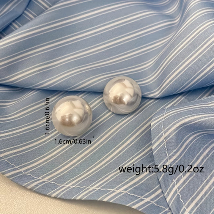 Stylish women's statement pearl stud earrings, a versatile accessory for an elegant touch to any ensemble.
