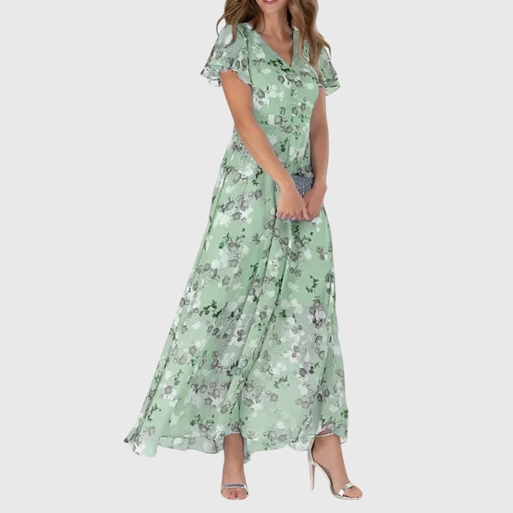 Stylish colorful women's dress. Figure-flattering design, suitable for all occasions, from casual to evening.